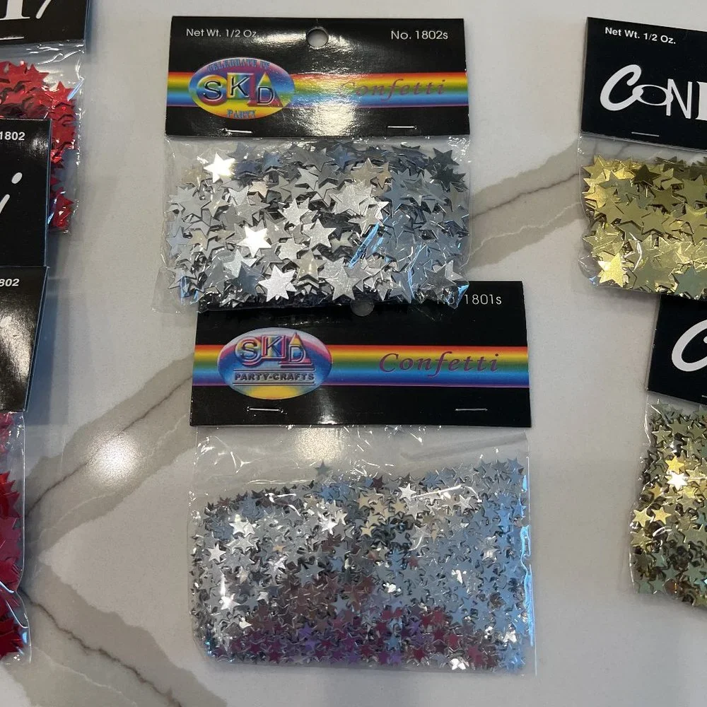 23 - 1/2 oz Packages of Star Shaped Confetti - Blue Red Silver Gold